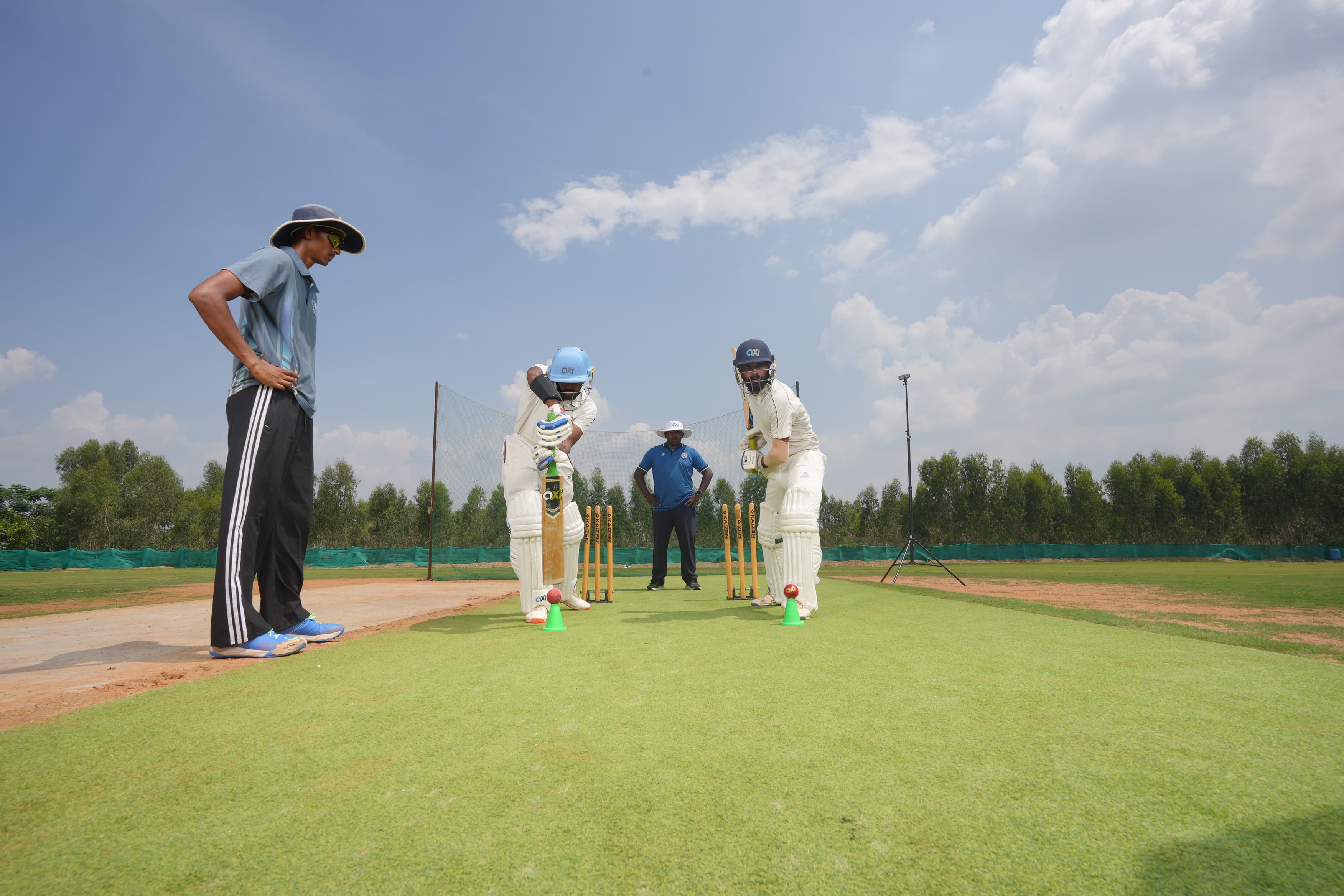 Bowler in action on the ground at Axi Cricket Park, Sarjapur