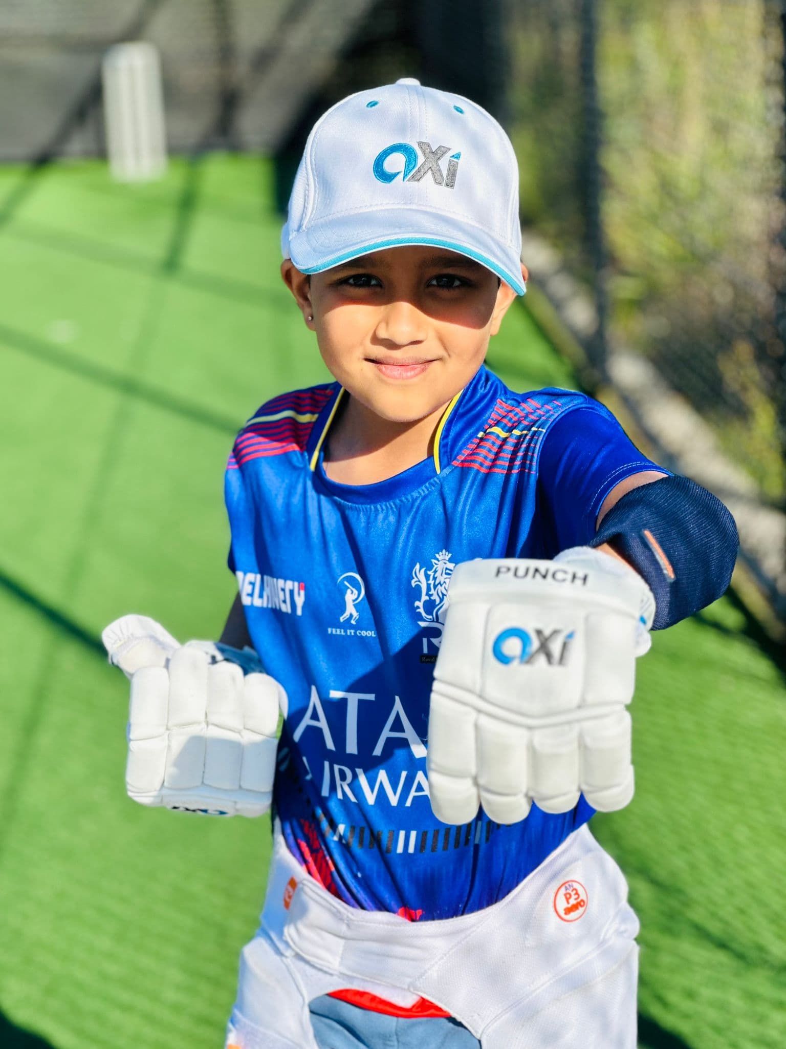 Young cricketer with Axi Sports cricket gear at the academy