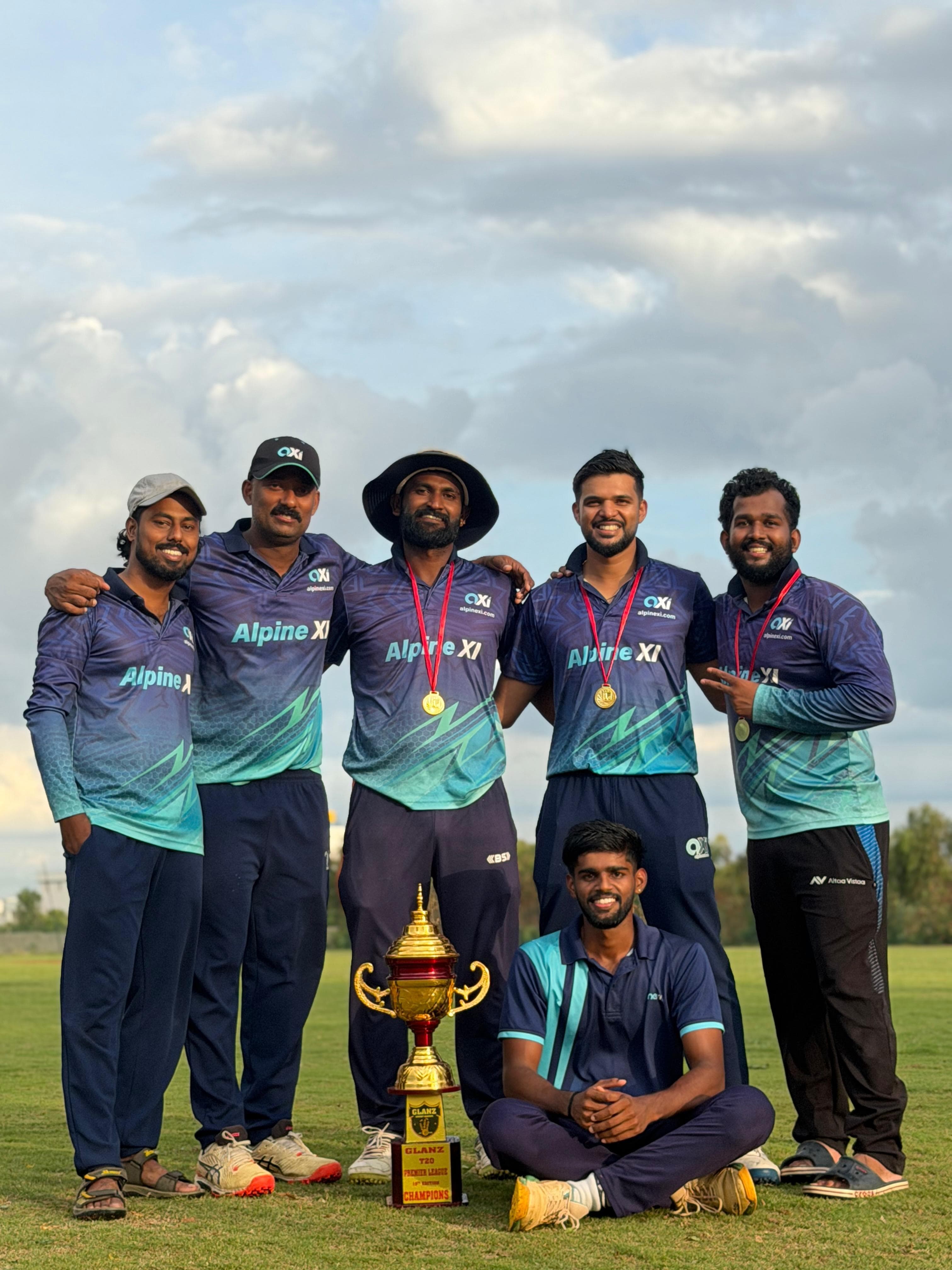 Axi Club players in club kit with the Glanz T20 Premier League trophy