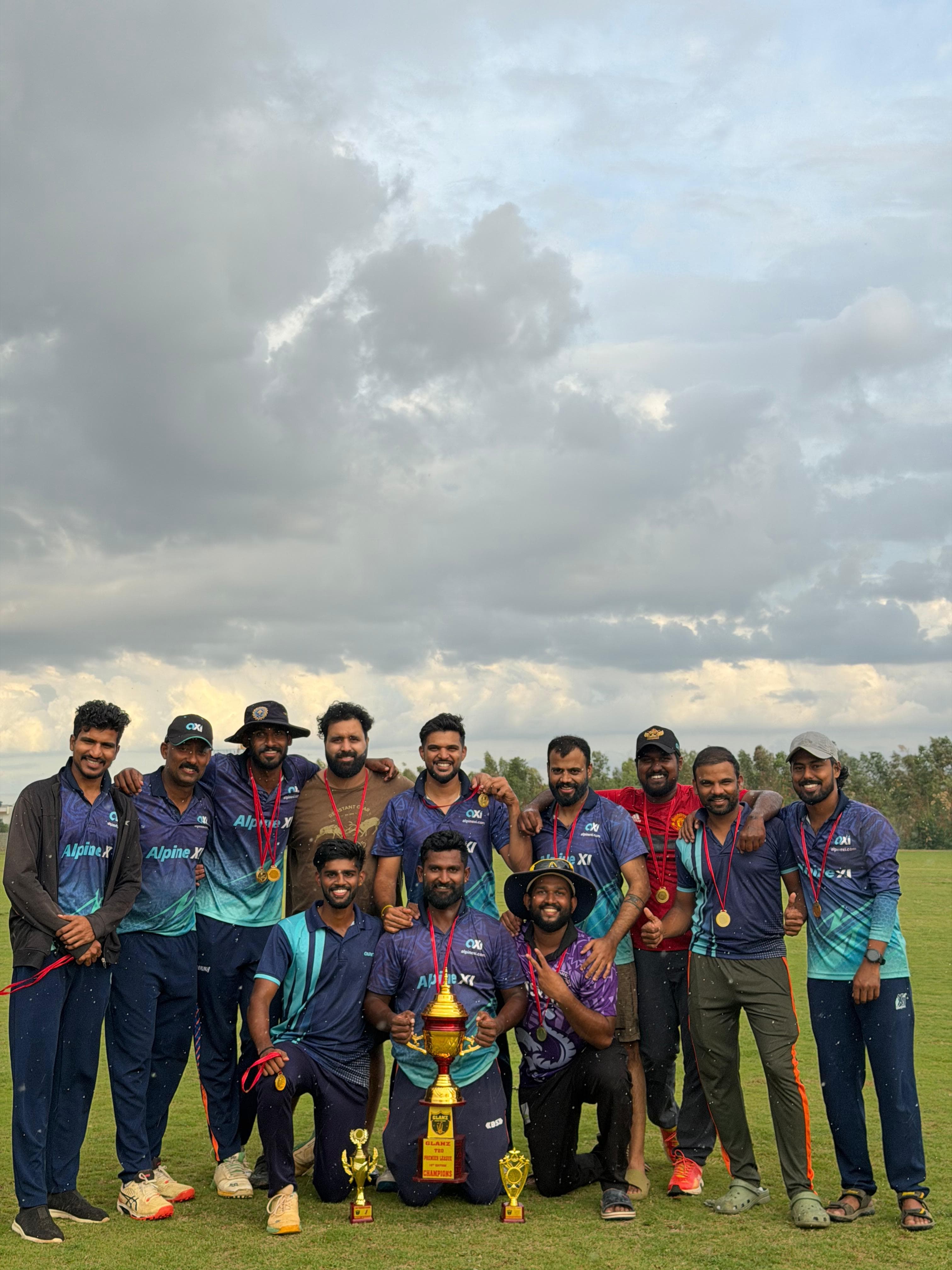Axi Club squad in club kit with the Glanz T20 Premier League champions trophy