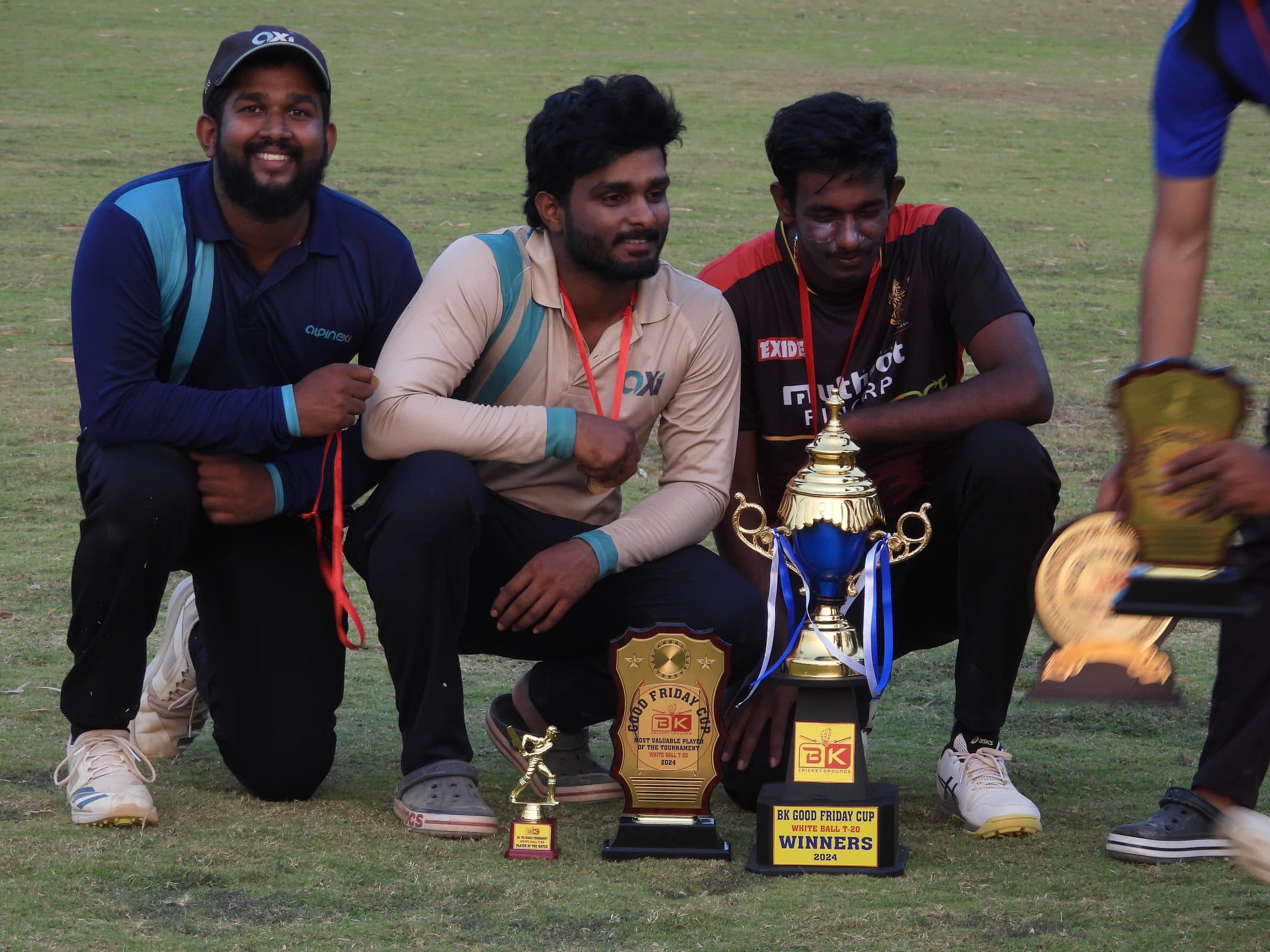 Axi Club players with the Good Friday Cup winners trophy and player of the tournament award