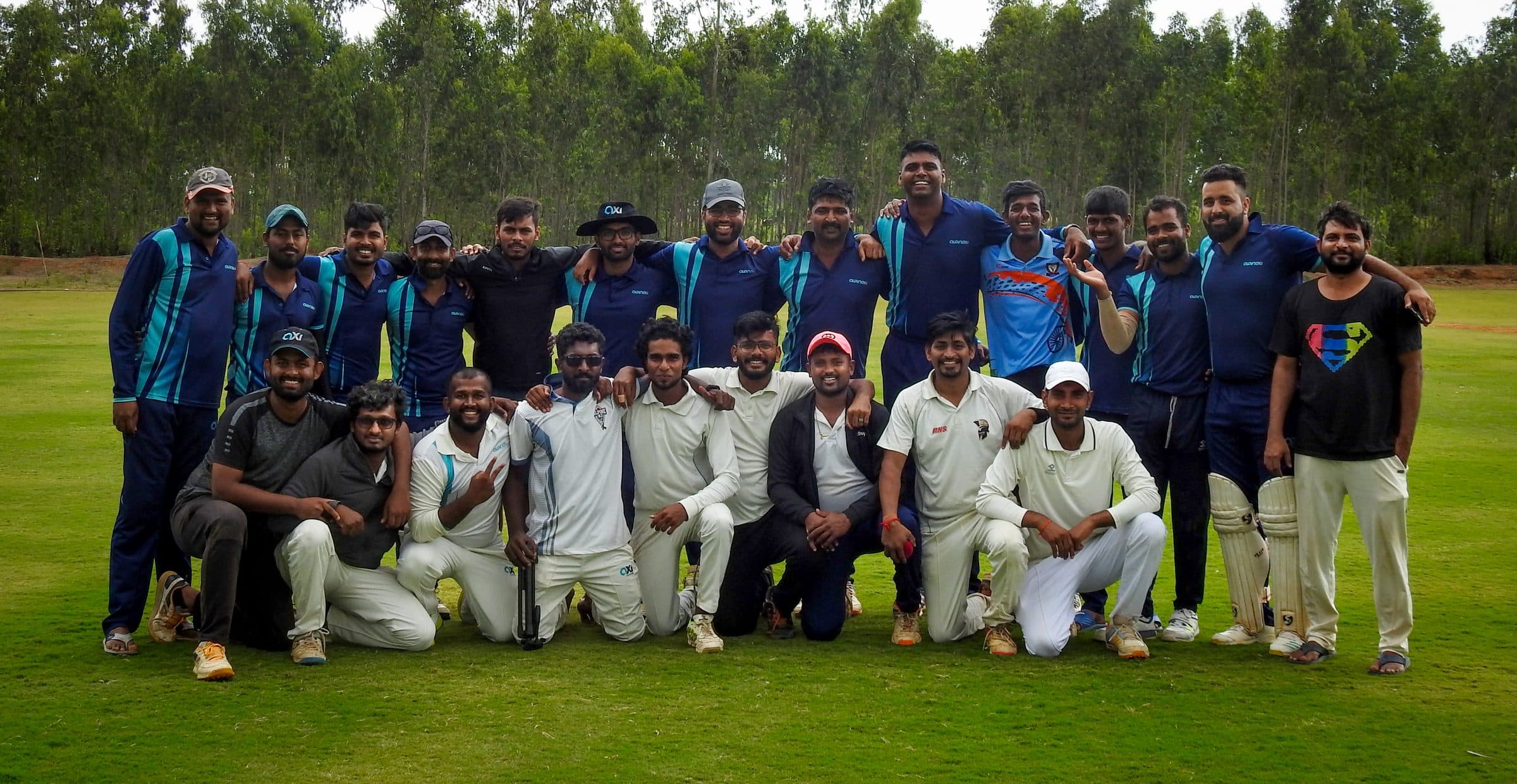 Full Axi Club squad group photo on the outfield after a match